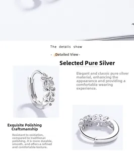 Macro-opname van S925 sterling zilveren oorringen met holle bloempatronen