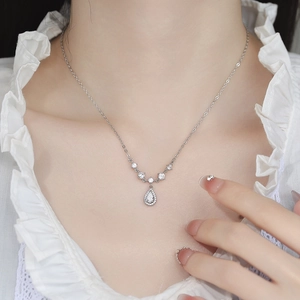 Elegant 925 sterling silver teardrop zircon necklace worn on minimalist white blouse