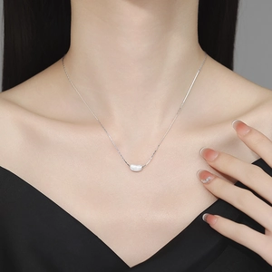 925 silver brushed pea pendant necklace on model showing elegant clavicle chain fit