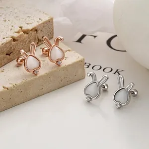 Detail of 925 silver rabbit stud earring with opal heart and screw back ball closure