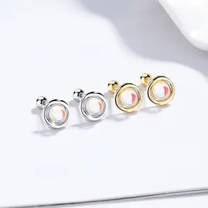 Detailed macro view of 925 silver sunflower stud earrings with moonstone in gold and silver