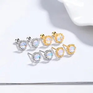 Detailed view of 925 silver and gold moonstone stud earrings with screw back design