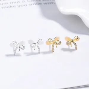 925 silver bow stud earrings with cat eye stones and sparkling cubic zirconia stones