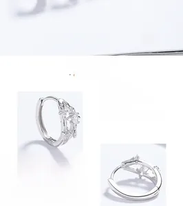 Vue macro détaillée des boucles d'oreilles étoile en argent 925 avec zircons blancs