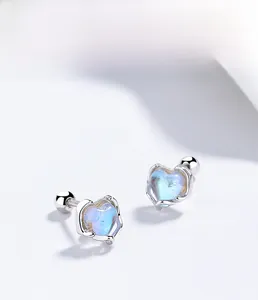 Detailed close-up of s925 sterling silver heart-shaped moonstone studs with electroplating
