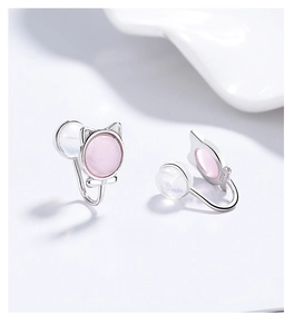 Close-up of S925 silver cat earrings featuring pink cat eye stones and bow details