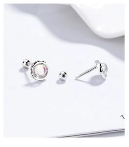 Macro detail of S925 sterling silver screw back earrings with iridescent moonstone