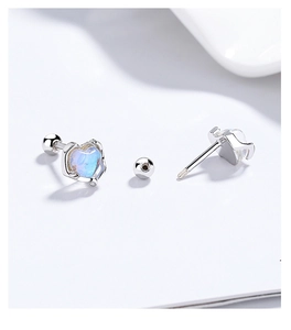 Detail of 925 sterling silver heart moonstone earrings with secure screw-back design