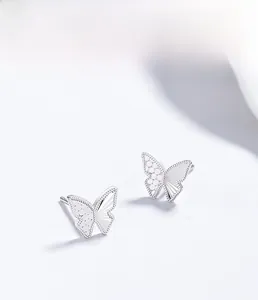 Detailed view of S925 sterling silver butterfly stud with intricate textured metal wings