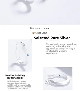 Detail view of 925 silver hoop earrings with brushed finish and blue zircon inlay
