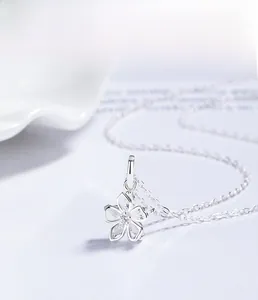 Close-up of S925 sterling silver flower pendant necklace with marquise zirconia stones