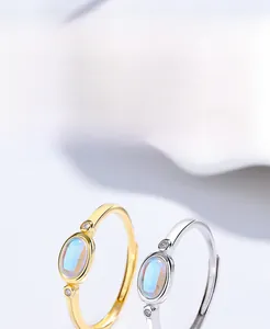Detailed view of S925 silver rings featuring oval moonstone and micro-set zircon accents