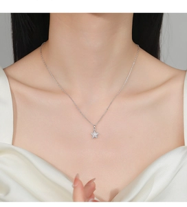 Close-up of 925 silver flower necklace with marquise zirconia crystals on a model