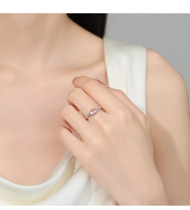 Detail of 925 sterling silver moonstone ring with zircon side stones on model hand