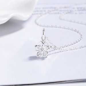 925 silver cherry blossom necklace with marquise-cut zircon petals on a white card