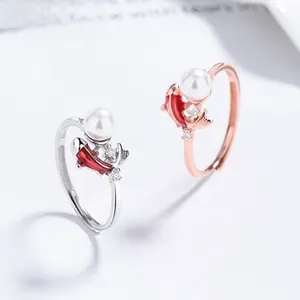 Close-up of S925 sterling silver koi fish rings with pearls and sparkling zircons