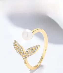 Macro detail of S925 sterling silver mermaid tail ring with pearl and zircon inlay