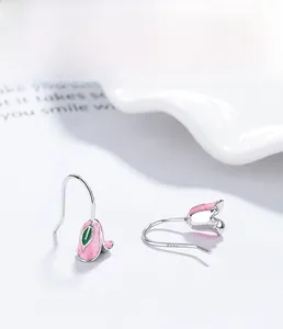 Detailed view of pink tulip earrings with S925 sterling silver hooks and enamel petals