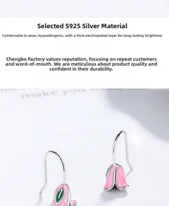 Macro detail of tulip flower earrings featuring S925 silver hooks and pink enamel finish