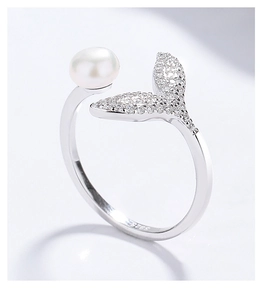 Close-up of S925 hallmark on a silver fishtail ring with pearl and zircon accents