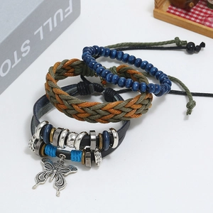Three-piece bohemian layered bracelet set featuring leather, beads, and silver butterfly charm