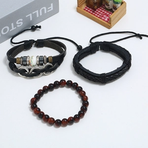 Three-piece set of vintage braided leather bracelets with silver accents and beads