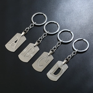 Minimalist stainless steel keychain set with cutout letters A B C D and brushed finish