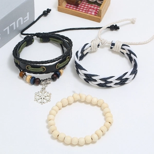Detailed set of multi-layer leather braided bracelets with beads and metal snowflake charm