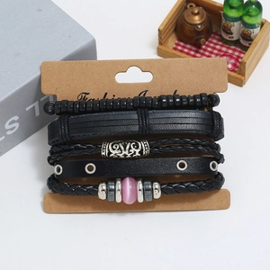 Five-piece punk leather bracelet set with vintage beads and pink stones on card