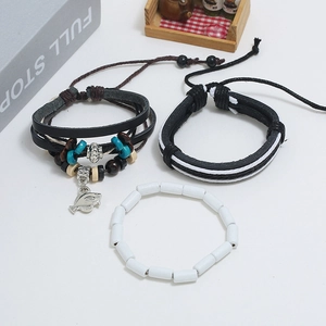 Three-piece bohemian beaded leather bracelet set with a silver fish charm and cord braids