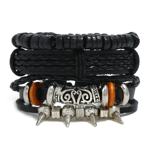 Detail of multi-layer leather braided bracelet set with punk vintage alloy charms