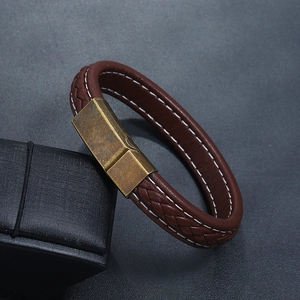 Close-up of brown multi-layer braided leather bracelet with vintage bronze magnetic clasp