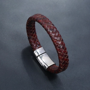Close-up of vintage braided brown leather bracelet with silver magnetic metal clasp
