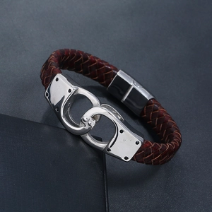 Detailed close-up of retro braided leather bracelet with creative handcuff clasp design