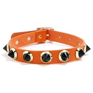 Bright orange punk leather choker with black metal spikes and golden studs adjustable