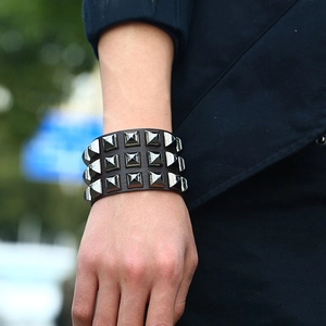 Punk wide black leather bracelet featuring three rows of silver pyramid metal studs