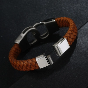 Men's brown braided leather bracelet with silver S-shaped magnetic clasp on black surface