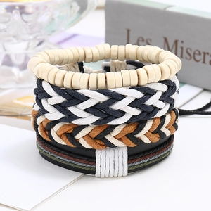 Detail of vintage 4-piece leather bracelet set with wooden beads and woven cords