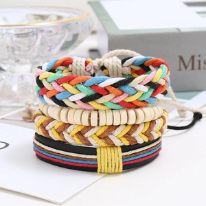Detail of four-piece stackable bohemian woven bracelets with beads and leather cords