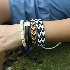 Men's retro four-piece woven leather and beaded bracelet set on model's wrist