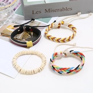 Bohemian style 4-piece woven leather and bead bracelet set for women on white background