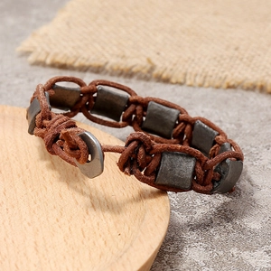 Retro handmade braided leather bracelet with matte metal charms for men's fashion