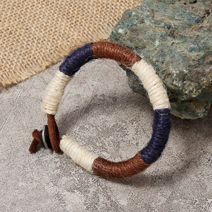Bohemian handmade braided bracelet featuring navy and brown fiber ropes with leather ties