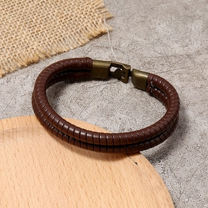 Bracciale vintage da uomo in pelle intrecciata marrone scuro con chiusura in bronzo