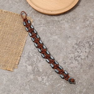 Retro woven leather bracelet for men featuring vintage metal beads and skull patterns