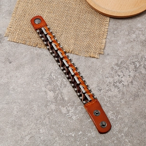Vintage braided leather bracelet for men with metal accents and adjustable snap closure