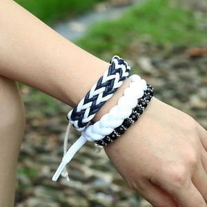 Three-piece DIY punk woven bracelets featuring black and white rope and beaded details