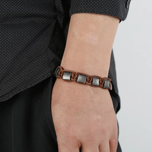 Vintage braided brown leather bracelet with five distressed square metal accents for men