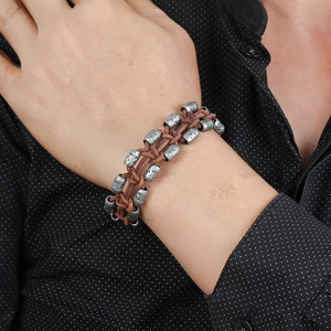 Retro punk style braided leather bracelet with vintage metal beads for men worn on wrist