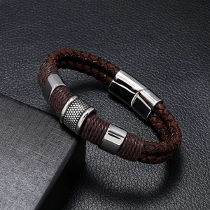 Macro view of braided leather men's bracelet with cylindrical stainless steel magnetic clasp
